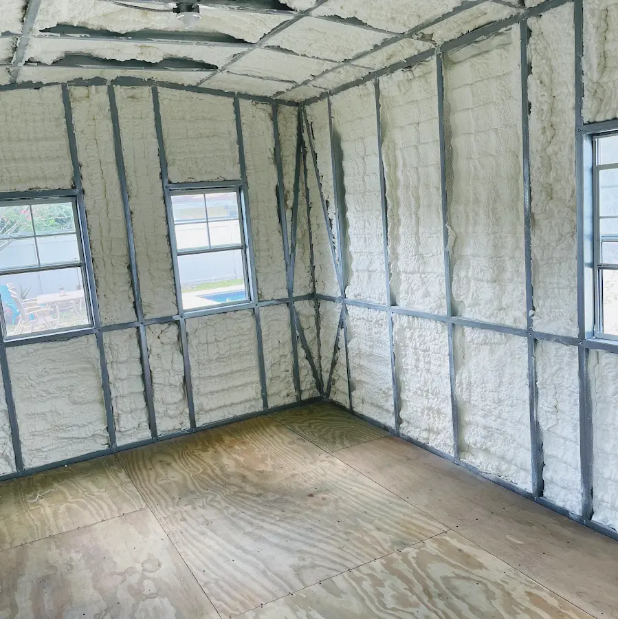 Closed-cell spray foam insulation applied to wall cavities in a residential project in Highland Park